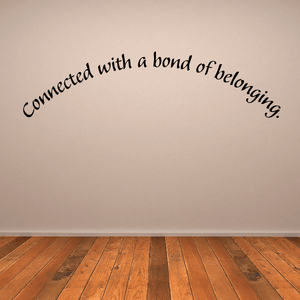 Wall decal with black cursive text: Connected with a bond of belonging.
