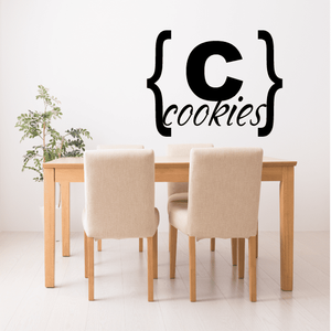 Black wall decal reading “cookies” with curly bracket style lettering