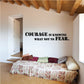 Wall decal with bold black quote: “COURAGE IS KNOWING WHAT NOT TO FEAR.”