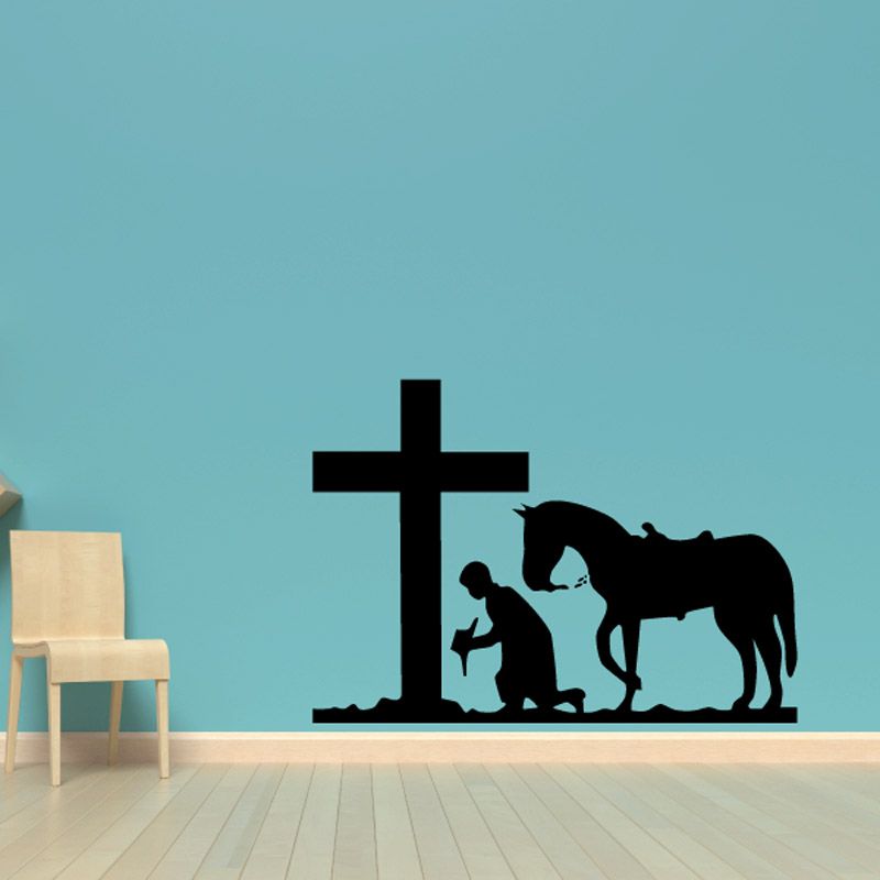 Image of Cowboy and horse kneeling before a cross paying decal