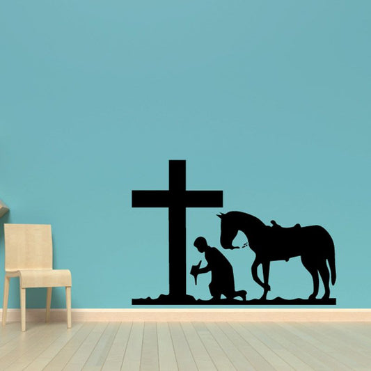 Image of Cowboy and horse kneeling before a cross paying decal