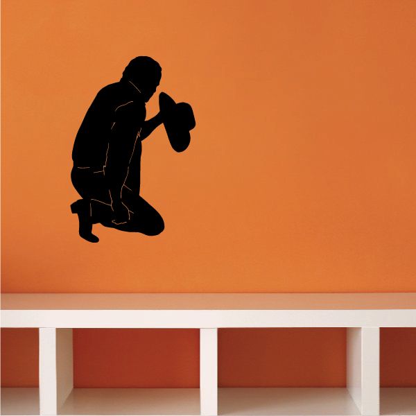 Cowboy praying decal, kneeling pose with one leg grabbed, dark silhouette