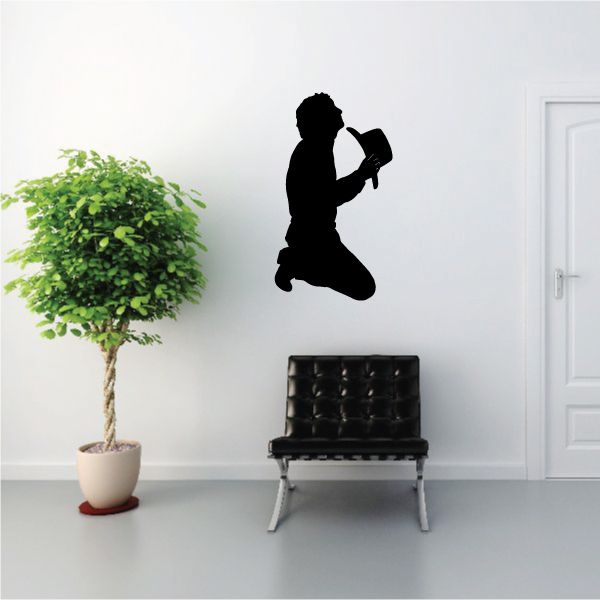 Praying cowboy holding a hat wall decal silhouette