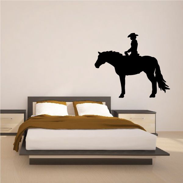 Cowboy silhouette on horseback vinyl wall decal, dark black