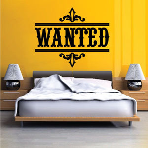 Wall decal with black 'WANTED' quote and ornate fleur-de-lis corner ornaments