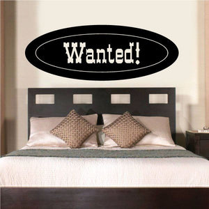 Wanted! black oval vinyl wall decal with white outline lettering