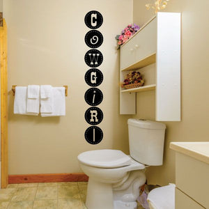 Black cowgirl wall decal with vertical circular letters spelling COWGIRL
