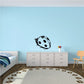 Black-and-white ladybug wall decal with round spots and small antennae