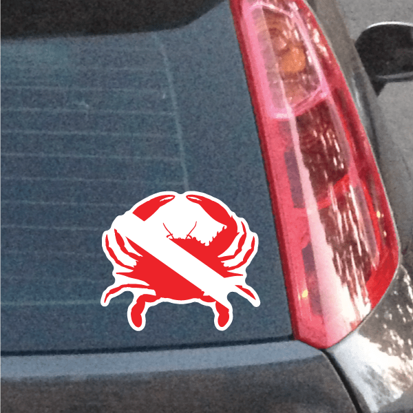 Crab diver sticker with red and white crab design on car window