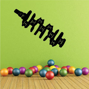 Black crankshaft-shaped decal with detailed cutout segments