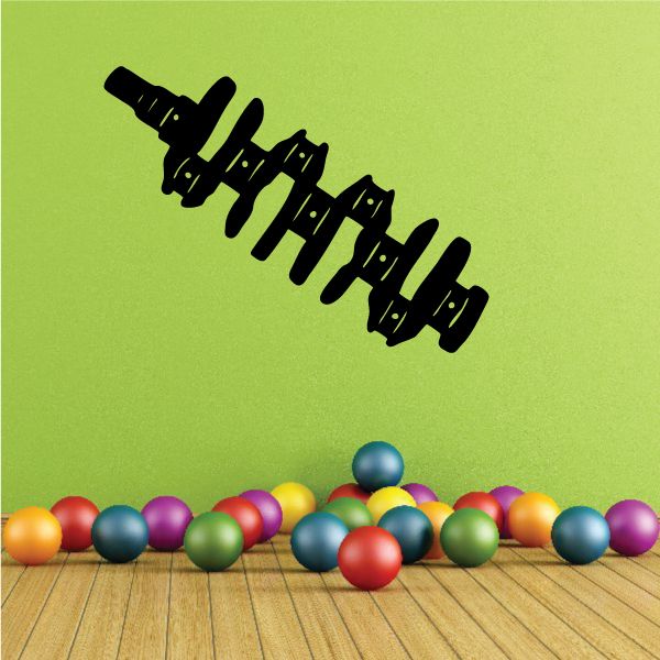 Black crankshaft-shaped decal with detailed cutout segments