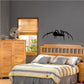 Black crawling spider wall decal silhouette with legs spread
