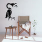 Black flying bird silhouette decal with stylized feather details