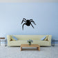Black spider decal with forward-leaning legs