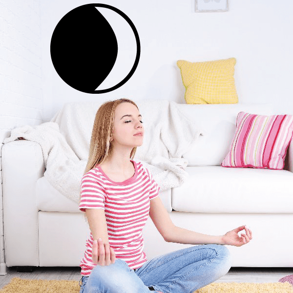 Black crescent moon astrology symbol vinyl decal on a wall