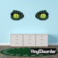 Two green reptile eye sticker decals with dark outline