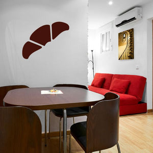 Croissant decal in dark brown on wall