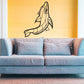 Black cross-contour dolphin wall decal above blue sofa
