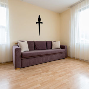 Cross dagger wall decal featuring a black cross with a long vertical blade