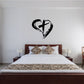 Black cross inside heart wall decal with ornate swirls
