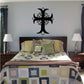 Black flower cross wall decal with symmetrical floral details