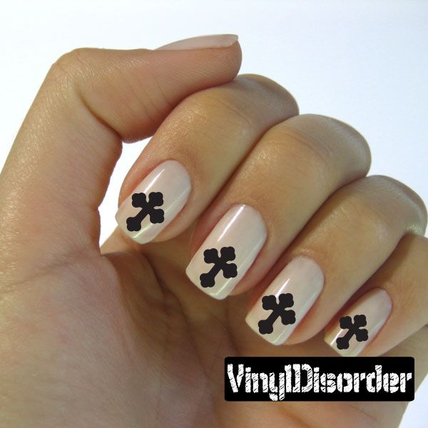 Cross nail art sticker set with black cross decals on white nails