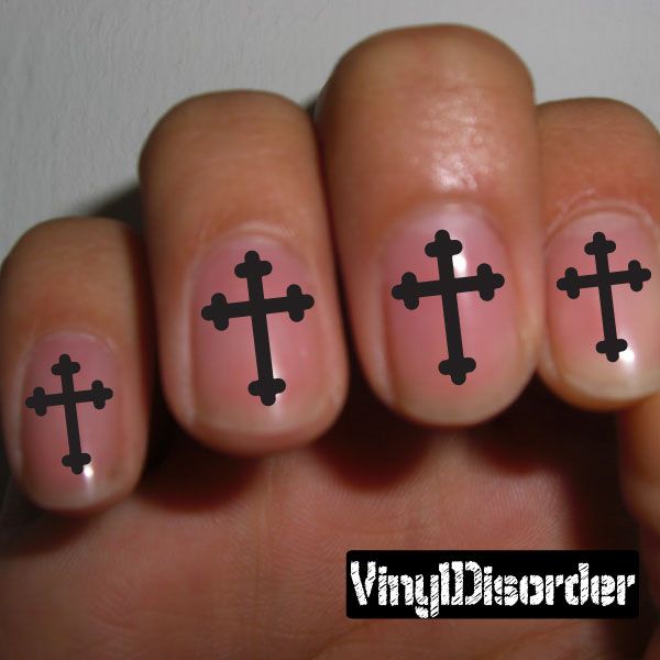 Cross nail art stickers with black cross designs on fingertips