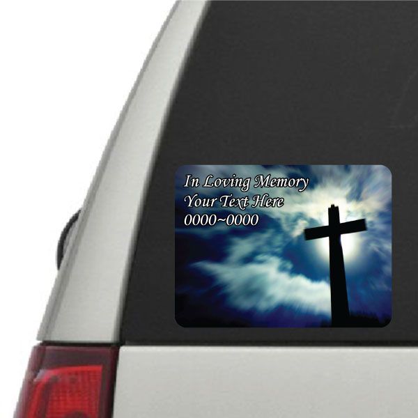 Rounded memorial sticker with blue clouds, black cross, and custom text