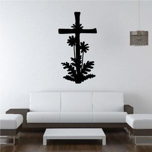 Black cross wall decal with floral and leafy silhouettes, dark ornamental design