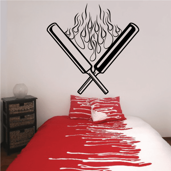 Crossed flaming cricket bats decal with outlined bats and stylized flame flames