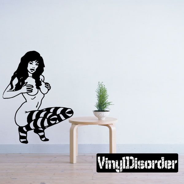 Crouched nude woman wall decal with striped socks and long hair
