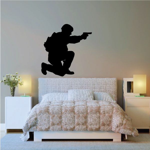 Black crouching soldier aiming handgun wall decal silhouette