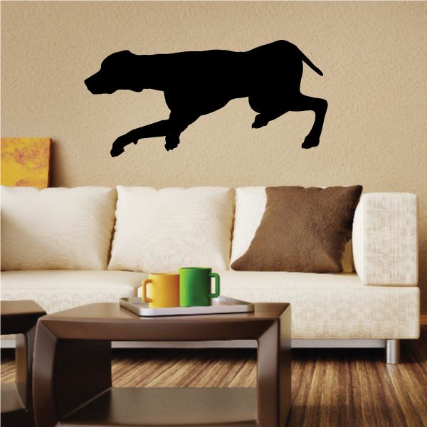 Crouching coonhound wall decal, black dog silhouette stretching left