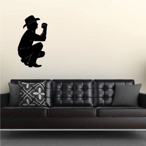 Crouching cowboy praying decal with black silhouette