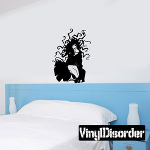 Crouching woman with wild hair wall decal, black silhouette