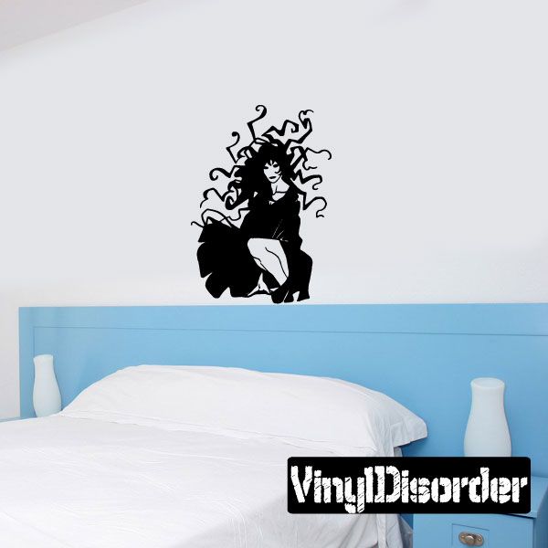 Crouching woman with wild hair wall decal, black silhouette