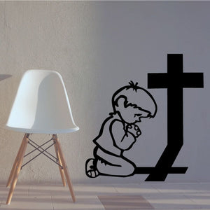 Praying boy and cross vinyl decal in black, kneeling boy with clasped hands