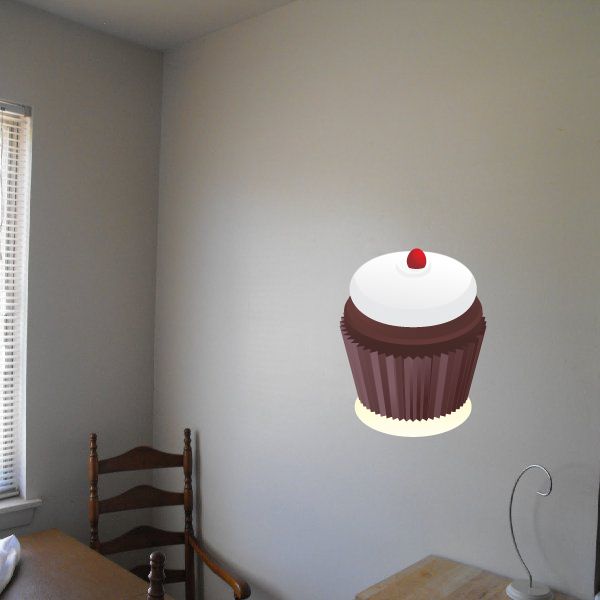Cupcake frosting sticker with white frosting, red cherry, and brown wrapper
