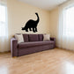 Black brontosaurus dinosaur vinyl wall decal silhouette above sofa