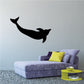 Black dolphin swimming wall decal
