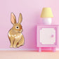 Easter bunny sticker of a sitting tan-and-white rabbit with long ears.