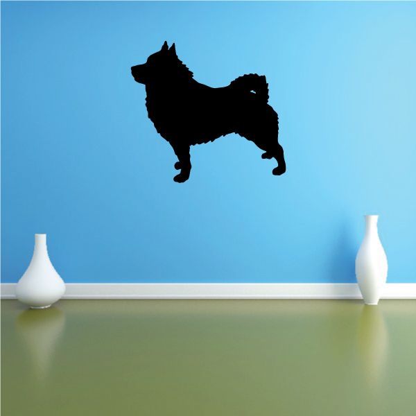 Curious Schipperke decal with black dog silhouette in mid-jump