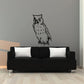 Owl decal with black outline and speckled body, watching pose