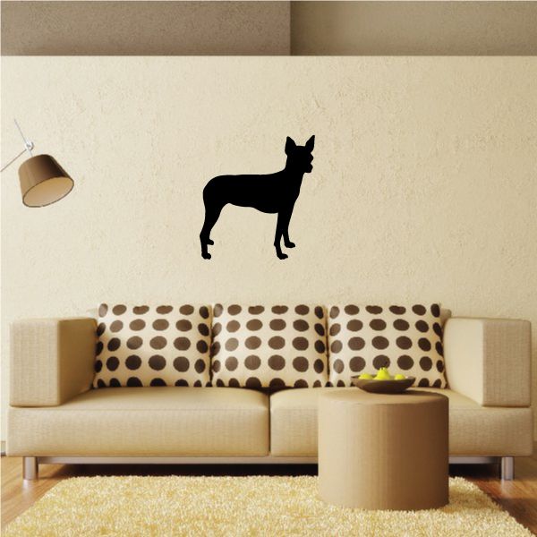 Black dog silhouette decal on a light wall