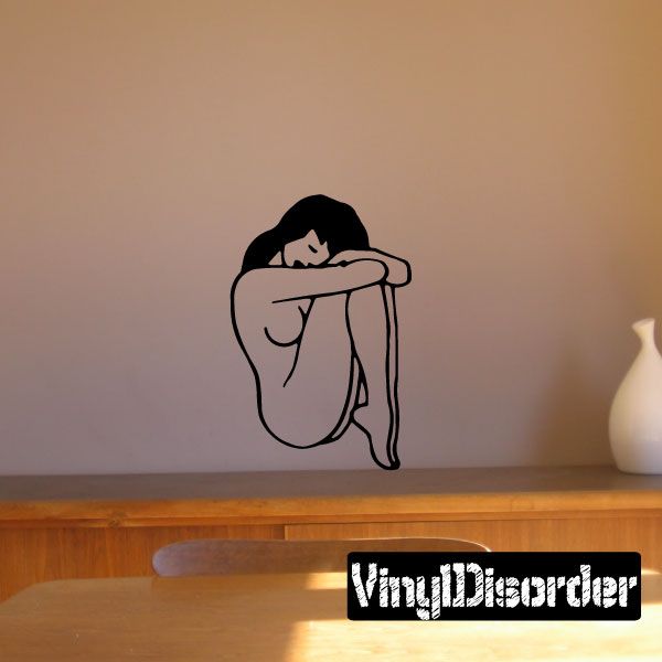Curled-up nude woman wall decal in black line art, sitting with arms around knees