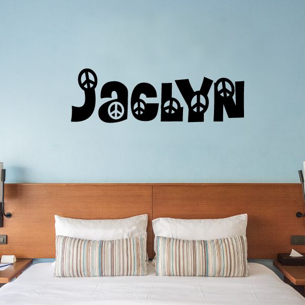 Peace sign name wall decal in black with peace symbols and stylized text