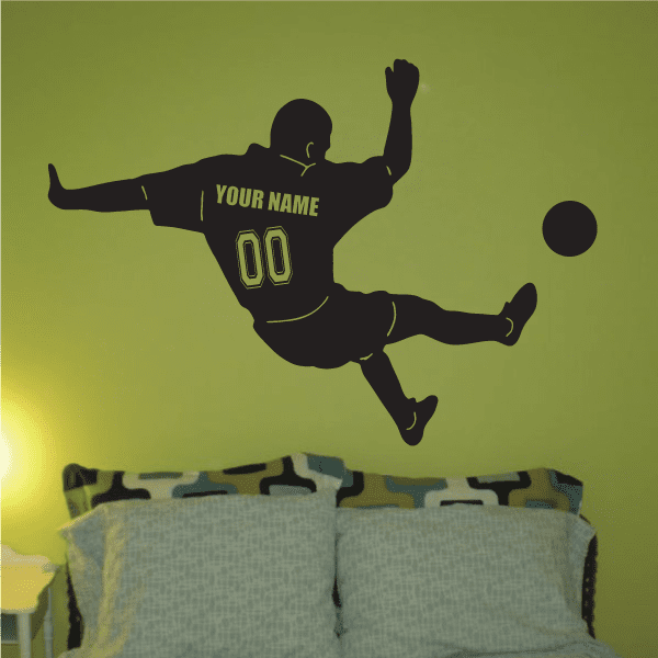 Custom soccer player wall decal—dark silhouette mid-kick with 'YOUR NAME' and number 00