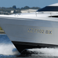 Boat registration ID lettering decal with two-tone yellow text reading MI 7102 BX