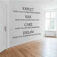 Wall quote vinyl decal with black lettering: EXPECT, RISK, CARE, DREAM