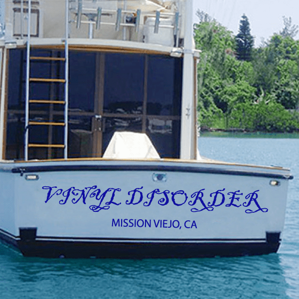 Vinyl boat name and port lettering decal, blue script and small city text on hull